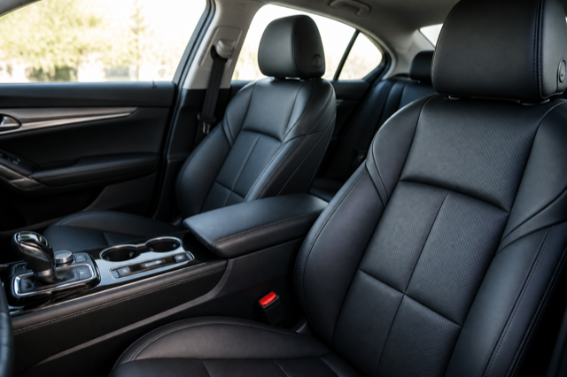 Clean black leather car seats and center console